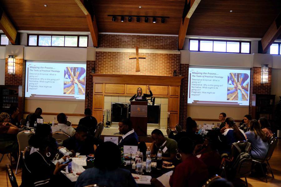Angela Reed speaking at Bridge to Belonging event.