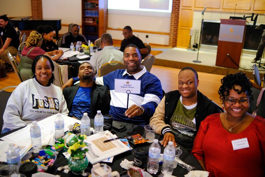 Church table at Bridge to Belonging event.